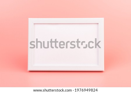 Blank photo frame at the wall. Copy space. Home Interior