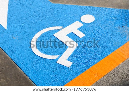 handicapped parking space in parking lot.