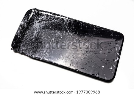 Broken phone screen on white isolated background, close up