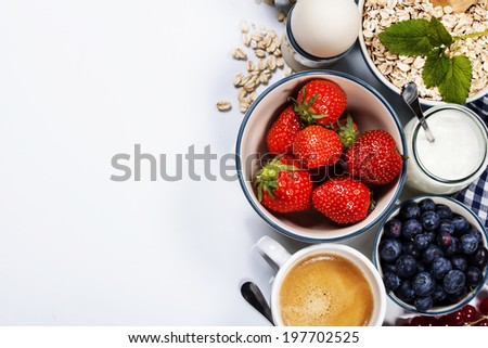 Healthy breakfast - yogurt with muesli and berries - health and diet concept Royalty-Free Stock Photo #197702525