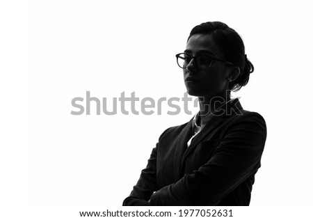 Silhouette of caucasian woman wearing suits.