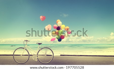 bicycle vintage with heart balloon on beach blue sky concept of love in summer and wedding Royalty-Free Stock Photo #197705528