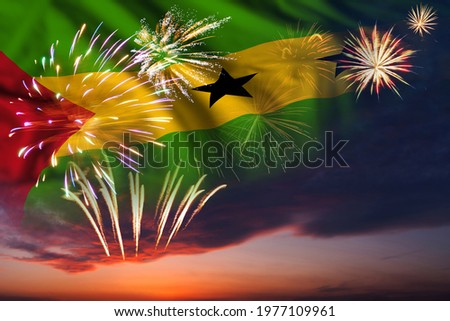 Holiday night sky with fireworks and flag of Sao Tome and Principe for Independence day