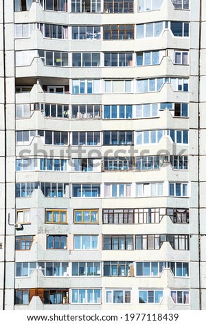 Facade of an apartment building. Architectural detail part of sity real estate property. Urban pattern. Modern multistory apartment house.