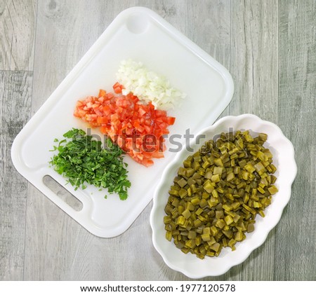 Ingredients for making ensalada de nopal or cactus salad.