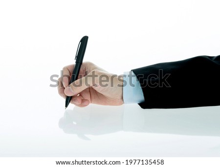 Businessman hand holding a pen on white background.