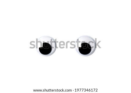 Pair of shaky plastic doll eyes isolated on white background.