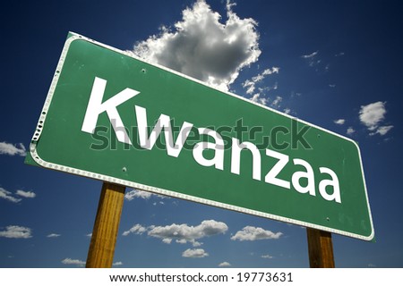Kwanzaa Road Sign with dramatic clouds and sky.