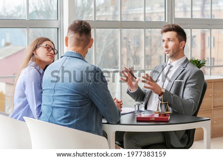 Couple visiting lawyer in office Royalty-Free Stock Photo #1977383159