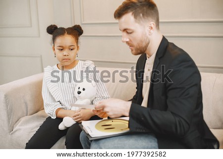 African American girl having session with pshycoterapist