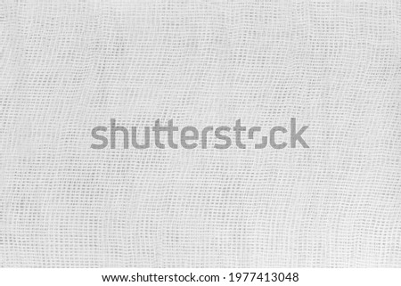 Background Texture of white medical bandage. cheesecloth texture Royalty-Free Stock Photo #1977413048