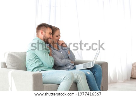 Couple video chatting at home