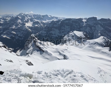 winter panorama picture from the mountain gemsairenstock towards toedi piz russein with the clariden glacier. mountains