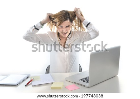 desperate business woman in stress at work with computer pulling hair isolated on white background