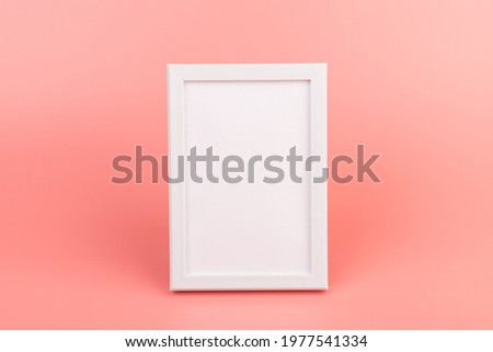 Blank photo frame at the wall. Copy space. Home Interior