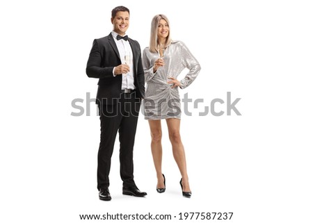 Elegant young man and woman holding glasses of sparkling wine isolated on white background