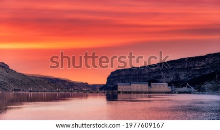 Snake river and Swan Falls dam in Idaho with sunrise reflection Royalty-Free Stock Photo #1977609167