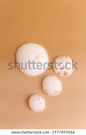 Cosmetic cleaning foam texture on neutral background