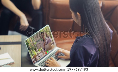 Medical service telemedicine online from doctor to patient virtual to hospital concept,woman making video call conference remote chat to physician consultation treatment mental health laptop computer Royalty-Free Stock Photo #1977697493