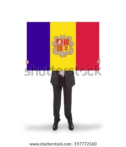 Businessman holding a big card, flag of Andorra, isolated on white