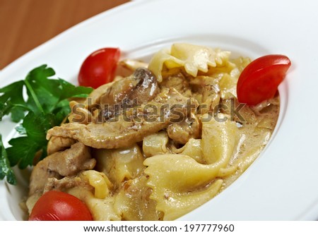 Farfalle pasta with veal and tomatoes