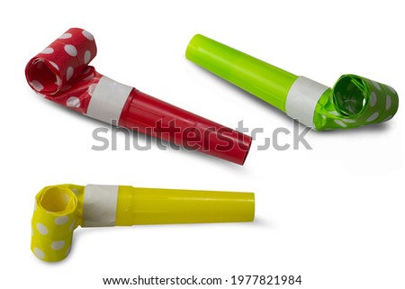 Trumpets are blowing colored clear paper on a white background,with clipping path Royalty-Free Stock Photo #1977821984
