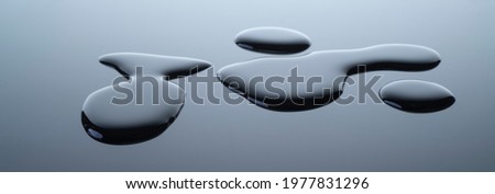 real image,spilled water drop on the floor isolated on gray gradient background.