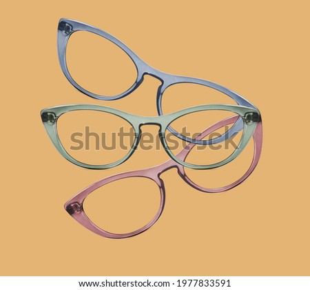 colorful glasses collage isolated on red, green and beige background, ideal photo template for display or advertising sign or for a web banner
