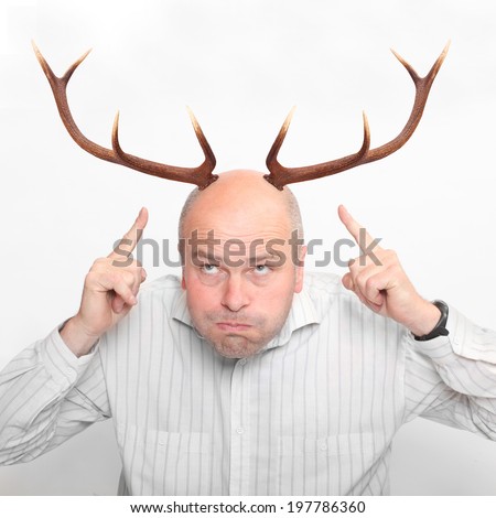 Funny picture of an manager (husband) with great antlers. 