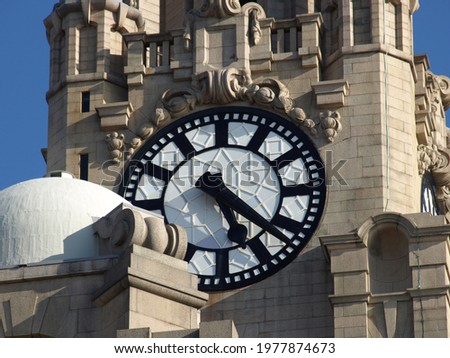 Clock face of the Liver Building on harbour front at Liverpool, UK