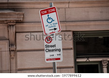 Sigs Tow zone HP-V Plate parking Only and No parking street cleaning in Boston.