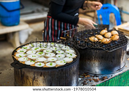 Picture of coconut milk pudding being made in a hot pan. 
