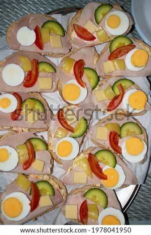Top view of homemade sandwich with egg, tomato and cucumber