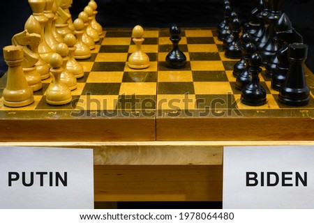 Russia vs USA, chess like geopolitics game. The names Putin and Biden by chessboard. Concept of summit meeting, political tension, economy war, sanctions, leadership and relations strategy. Royalty-Free Stock Photo #1978064480