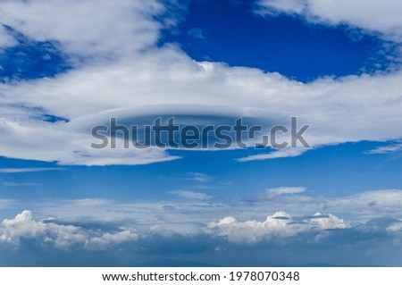 Cloud ufo (Altocumulus lenticularis) on blue sky. Royalty-Free Stock Photo #1978070348