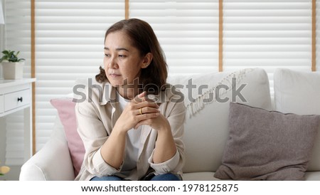 Unhappy Female employee latin mom think sit sofa couch at home living room need help support panic coronavirus financial debt crisis in life insurance feel pain distress pensive regret lost upset. Royalty-Free Stock Photo #1978125875