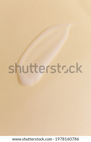 Cosmetic cream texture on neutral background