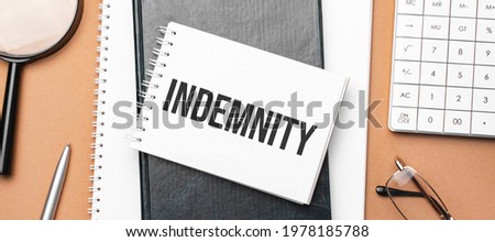 indemnity on notepad and various business papers on brown background. Brown glasses and magnifier with notepad. Royalty-Free Stock Photo #1978185788