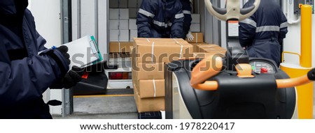 Picking up package boxes in the loading area of cold storage warehouse prepare to transfer storage in freezing room with note. Storage Warehouse Service in Logistics Business concept in Banner size.