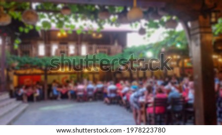 Blurred background with bokeh elements in a creative plot on the theme of holiday, evening feast and mass events for poster, banner and creative design. Stock content.