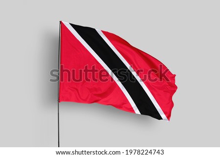 Trinidad and Tobago flag isolated on white background with clipping path. close up waving flag of Trinidad and Tobago. flag symbols of Trinidad and Tobago.