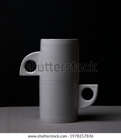 Closeup shoot of two white coffee cups in black background  HD image 