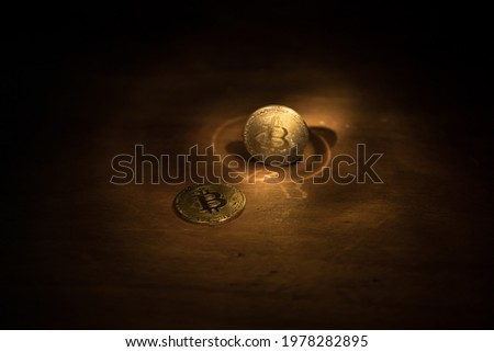 Golden Bitcoin on dark backround. New virtual money. Crypto currency. Creative artwork decoration. Selective focus