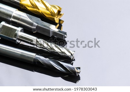 cutting tools special set. Drill, endmill, reamer, burnishing. spiral right hand. material Carbide and high speed steel, coating Titanium nitride. for steel, aluminium. isolated on back background. Royalty-Free Stock Photo #1978303043