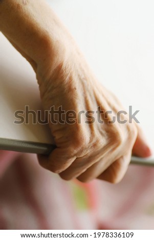 The Hand of Senior Lady lying On The Nursing Bed, close up picture