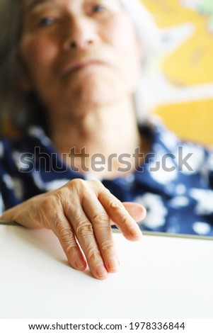 The Hand of Senior Lady lying On The Nursing Bed, close up picture
