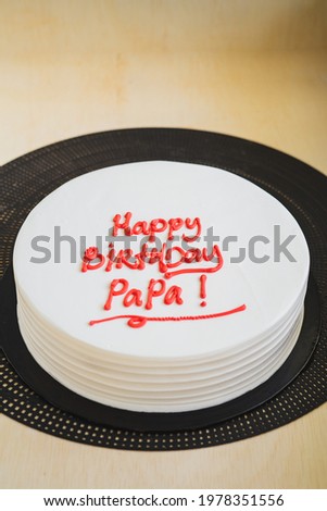 Birthday Cake for Dad written "Happy Birthday Papa" on the table. Fatherhood moment special day.