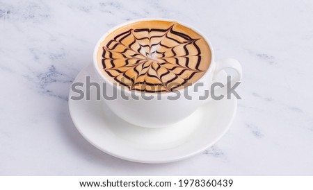 Chocolate cappuccino cup isolated on white.