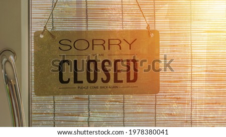 Sorry we are closed sign hanging outside a restaurant, store, office or other,Covid-19