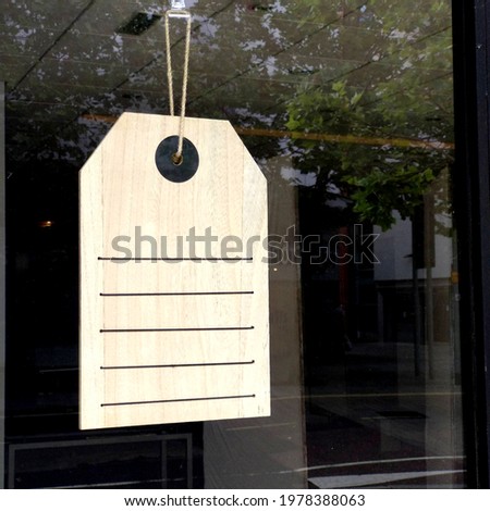 Storefront window with blank retail tag sign